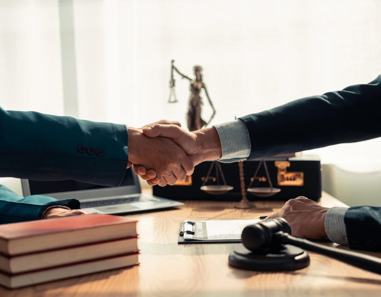 Business handshake in office setting