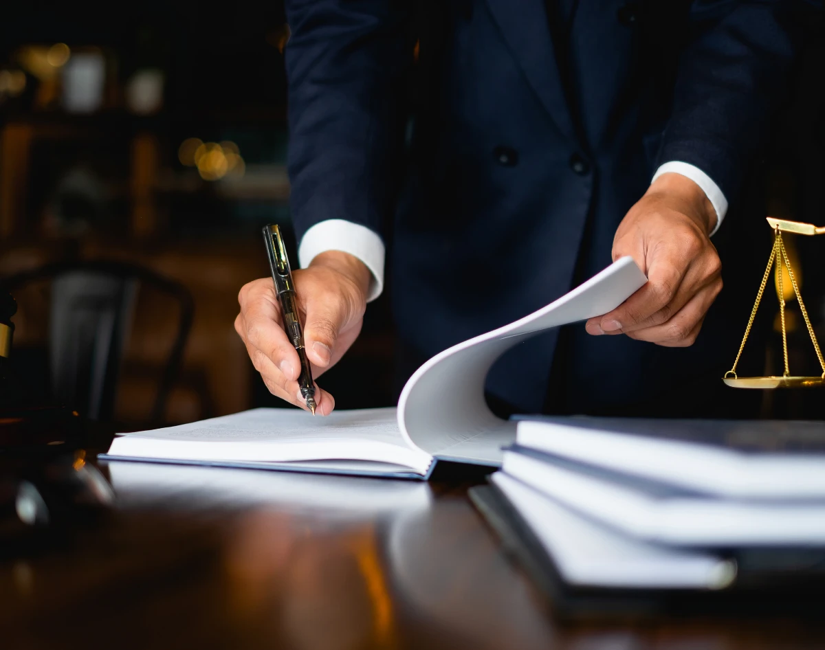 Businessman signing legal papers
